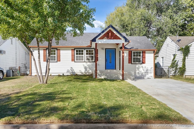 bungalow-style house featuring a front yard