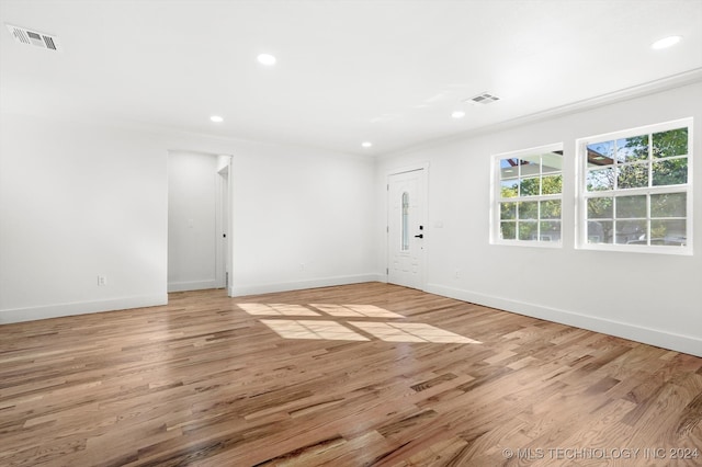 unfurnished room with light hardwood / wood-style floors