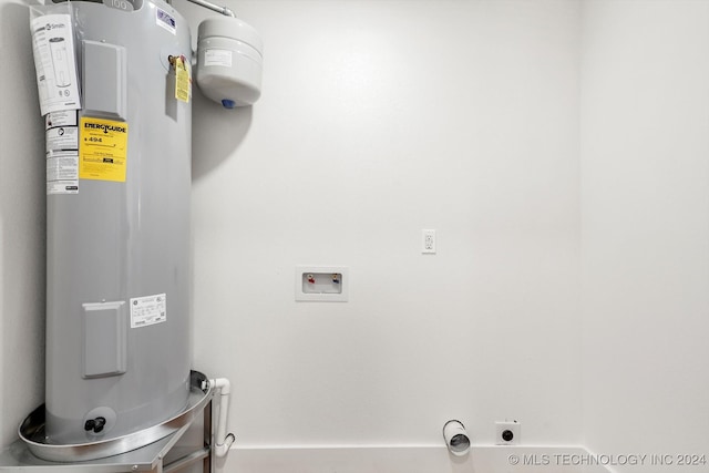 laundry area featuring electric water heater, electric dryer hookup, and hookup for a washing machine