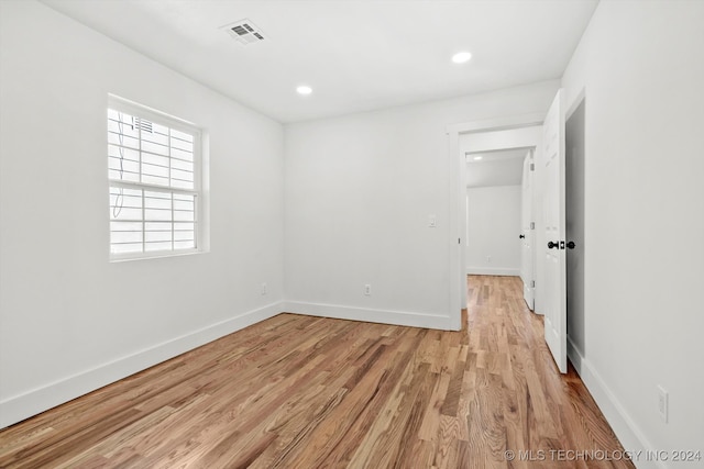 spare room with light wood-type flooring