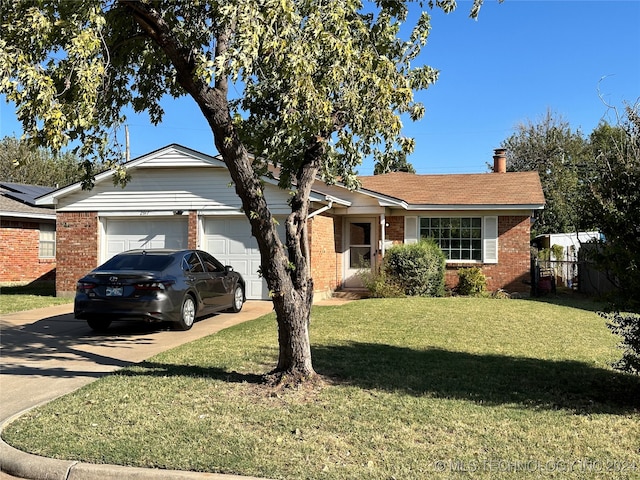 ranch-style house featuring a front lawn and a garage