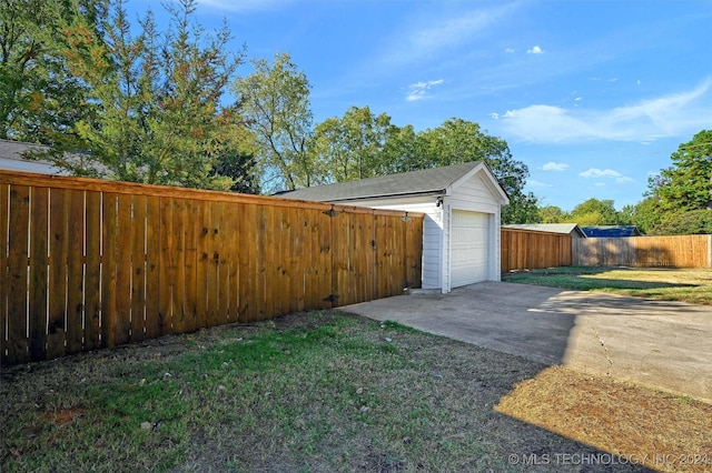 garage with a yard