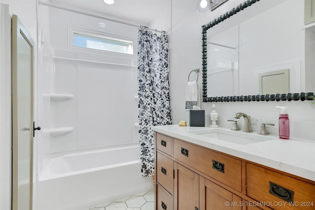 bathroom with vanity, shower / tub combo, and tile patterned floors