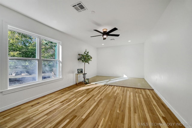 unfurnished room featuring ceiling fan and light wood-type flooring