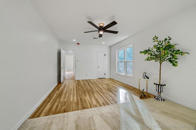 unfurnished room featuring hardwood / wood-style flooring and ceiling fan