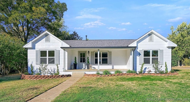 view of front of home featuring a front lawn and a porch