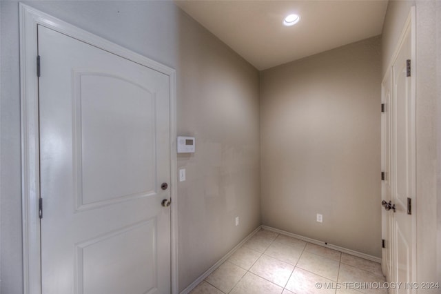 entryway with light tile patterned floors