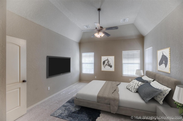 bedroom with ceiling fan, light colored carpet, and lofted ceiling