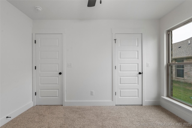 10804 S 274th Ave E, Coweta, OK 74429 - unfurnished bedroom featuring carpet, multiple windows, and baseboards