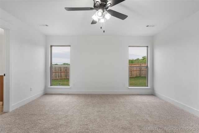 10804 S 274th Ave E, Coweta, OK 74429 - carpeted spare room with plenty of natural light, baseboards, and a ceiling fan