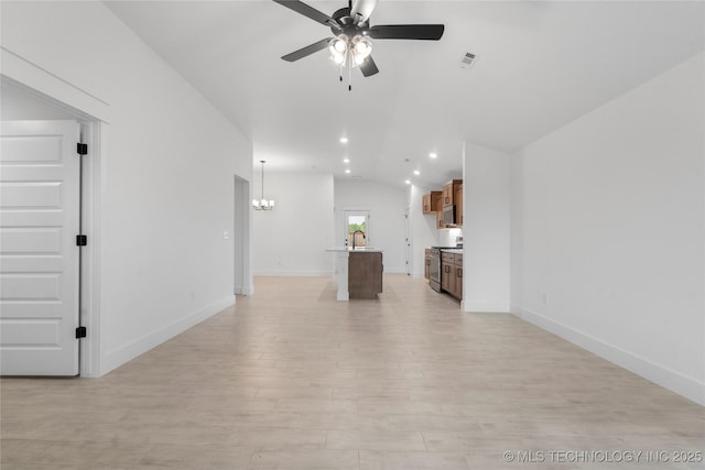 10804 S 274th Ave E, Coweta, OK 74429 - unfurnished living room with lofted ceiling, ceiling fan, a chandelier, a sink, and light wood finished floors