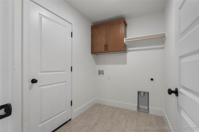 10804 S 274th Ave E, Coweta, OK 74429 - laundry area with light wood finished floors, hookup for a washing machine, electric dryer hookup, cabinet space, and baseboards