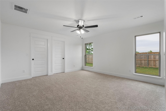 10804 S 274th Ave E, Coweta, OK 74429 - unfurnished bedroom featuring baseboards, carpet, and ceiling fan