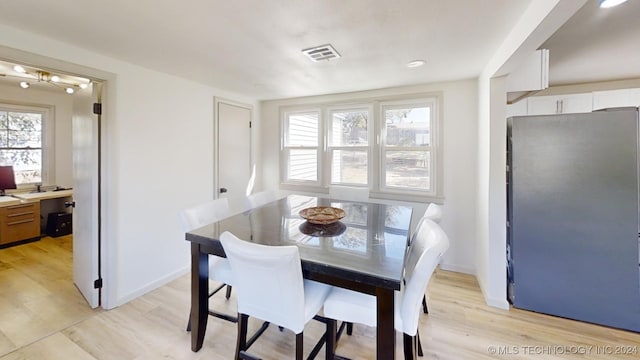 dining room with light wood-type flooring