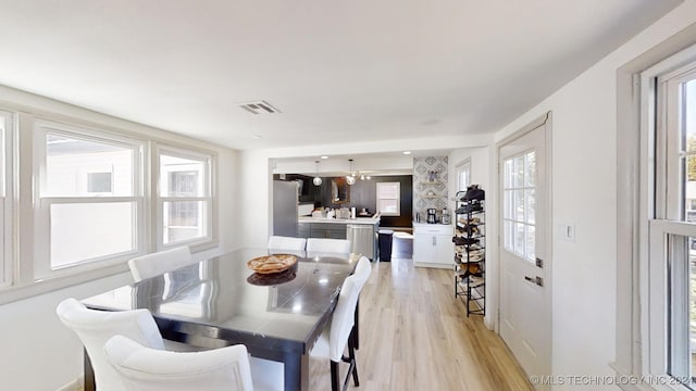 dining space featuring light hardwood / wood-style flooring