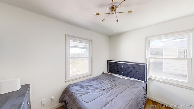 bedroom with hardwood / wood-style floors