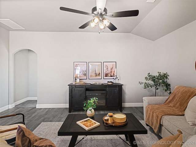 living room with dark wood-type flooring, ceiling fan, and lofted ceiling