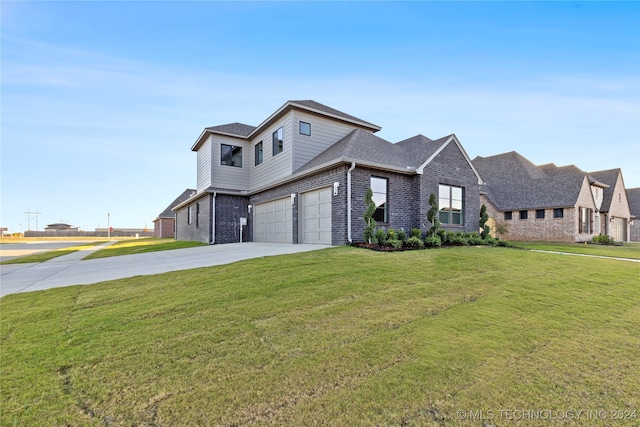 view of front facade featuring a garage and a front lawn