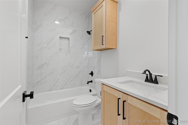 full bathroom featuring vanity, toilet, and tiled shower / bath combo