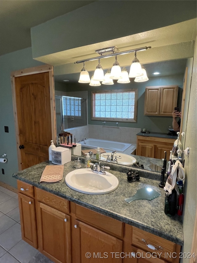 bathroom with vanity, tile patterned floors, and a washtub