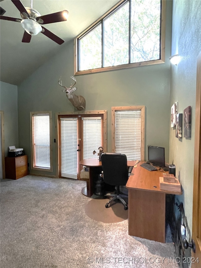 carpeted office featuring a healthy amount of sunlight, high vaulted ceiling, and ceiling fan