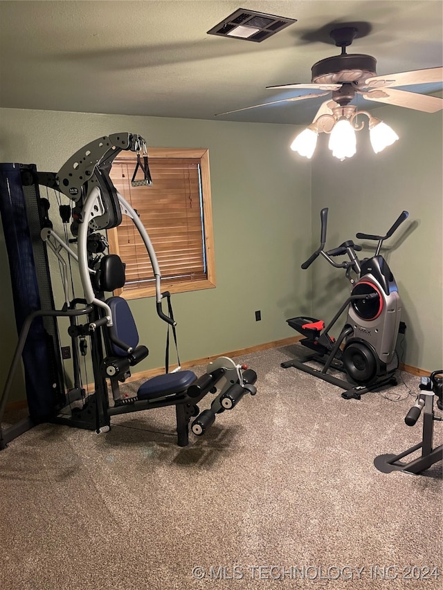 exercise area with carpet flooring and ceiling fan