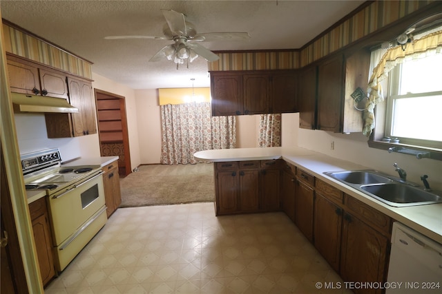 kitchen featuring white appliances, sink, a textured ceiling, kitchen peninsula, and ceiling fan