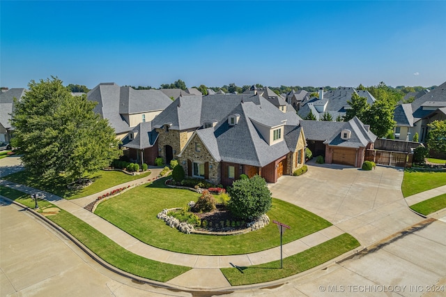 view of front of house featuring a front yard and a garage