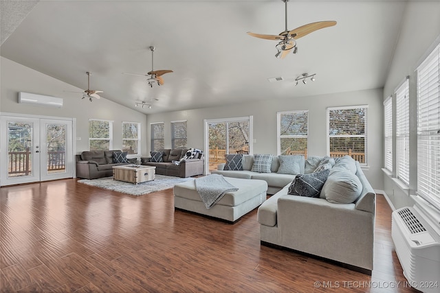 living room featuring an AC wall unit, lofted ceiling, dark hardwood / wood-style floors, and ceiling fan