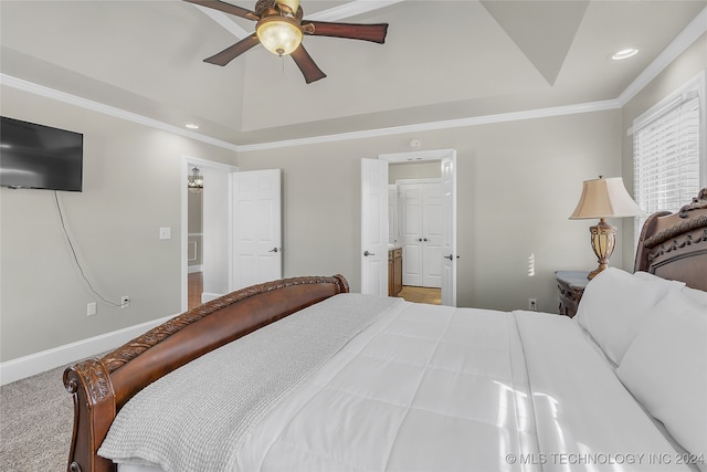 bedroom with ornamental molding, carpet, vaulted ceiling, and ceiling fan