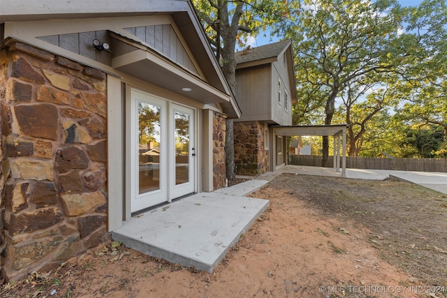 doorway to property with a patio area and french doors