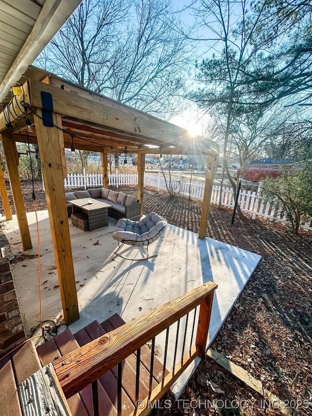 wooden terrace featuring an outdoor hangout area and a patio area