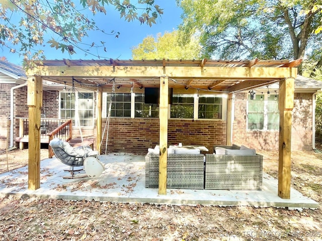 rear view of property featuring a wooden deck and outdoor lounge area