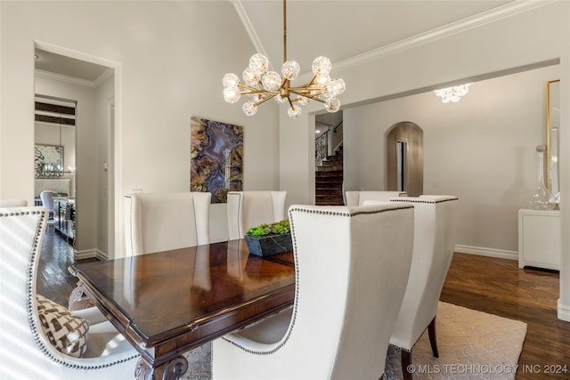 dining space featuring ornamental molding, a notable chandelier, and dark hardwood / wood-style floors