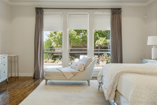 bedroom with multiple windows, dark wood-type flooring, and crown molding