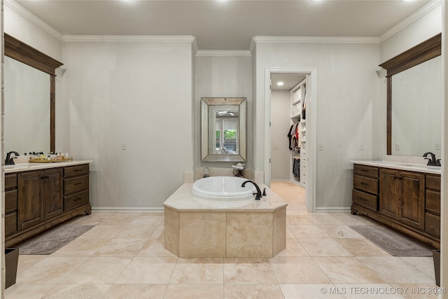 bathroom with vanity, tiled bath, and ornamental molding