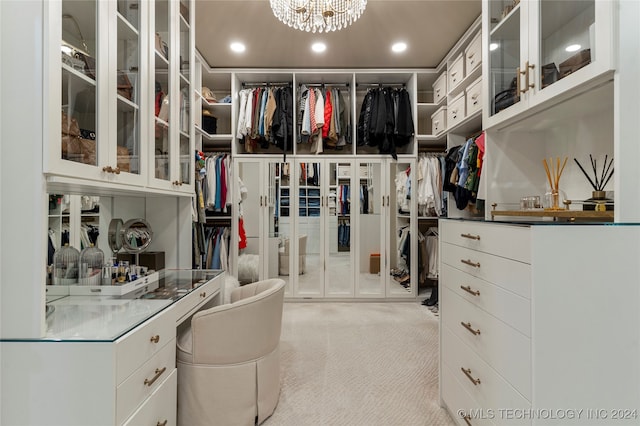 walk in closet featuring light carpet