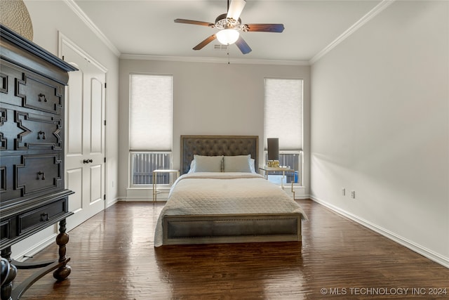 bedroom with crown molding, dark hardwood / wood-style floors, a closet, and ceiling fan