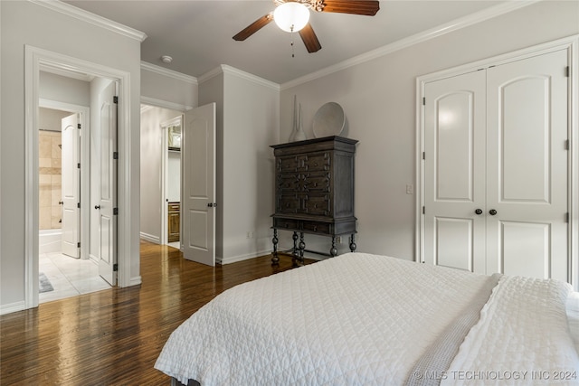 bedroom with crown molding, ceiling fan, a closet, and dark hardwood / wood-style flooring