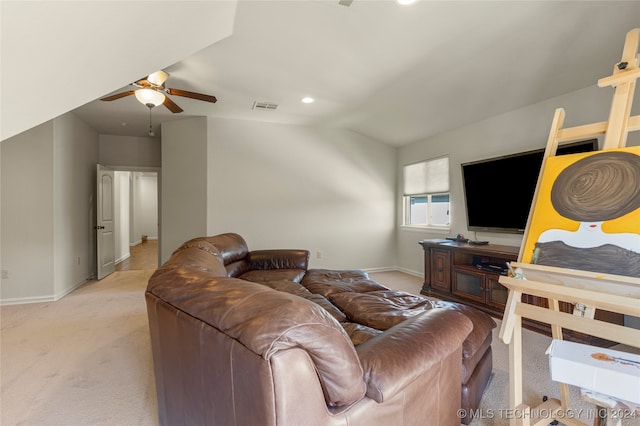 carpeted living room featuring vaulted ceiling and ceiling fan