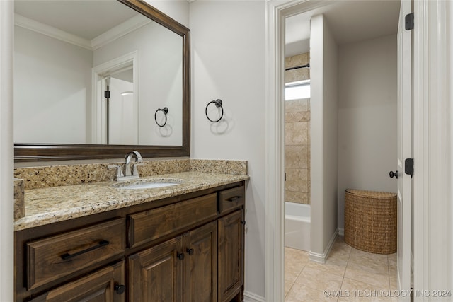 bathroom with vanity, crown molding, and tile patterned flooring