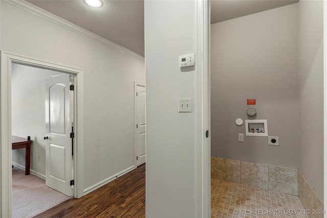 hall featuring crown molding and dark hardwood / wood-style flooring