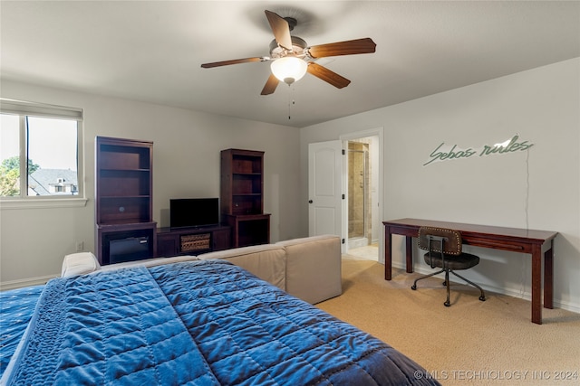 carpeted bedroom with connected bathroom and ceiling fan