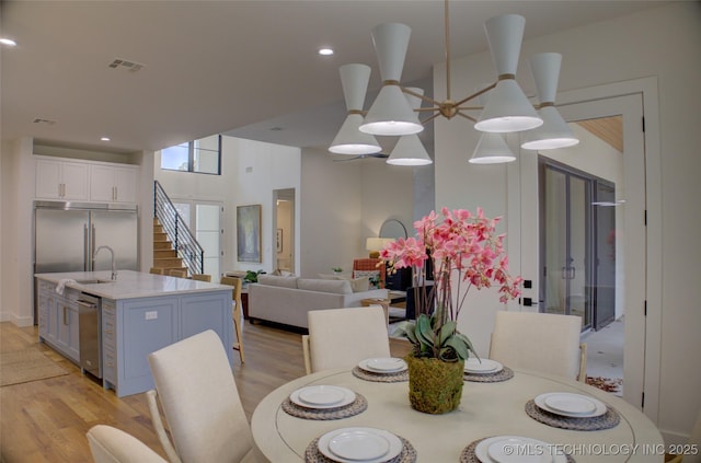 dining room featuring light hardwood / wood-style floors and ceiling fan