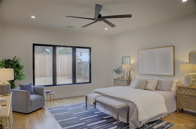 bedroom featuring wood-type flooring and ceiling fan