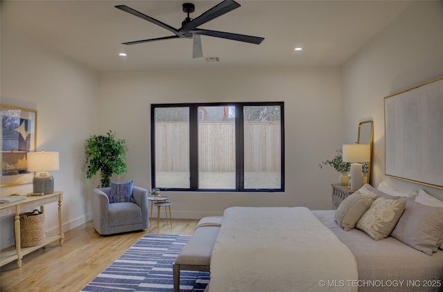 bedroom with light wood-type flooring and ceiling fan