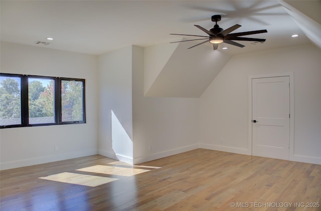 bonus room featuring ceiling fan, light hardwood / wood-style flooring, and vaulted ceiling