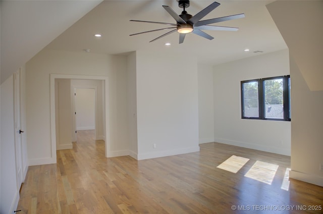 empty room with light hardwood / wood-style floors and ceiling fan