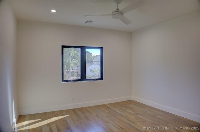 unfurnished room with ceiling fan and light wood-type flooring