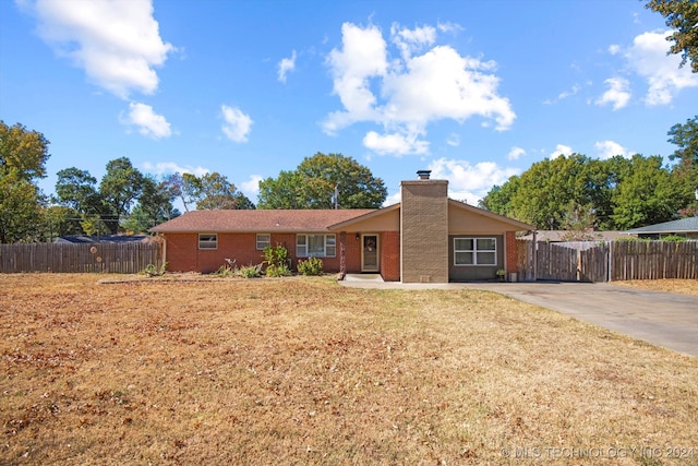 ranch-style house with a front yard